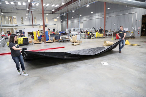 laying truck trailer tarp flat on the ground